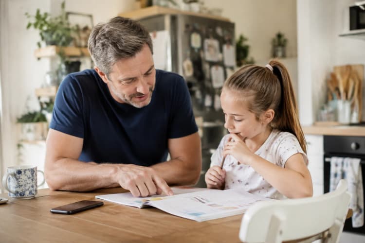 A father and daughter learning together